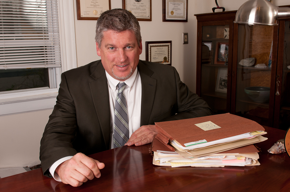 Attorney Paul J. Dickman principal from Dickman Law Office P.S.C. sitting at his desk